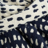 Navy dots throw