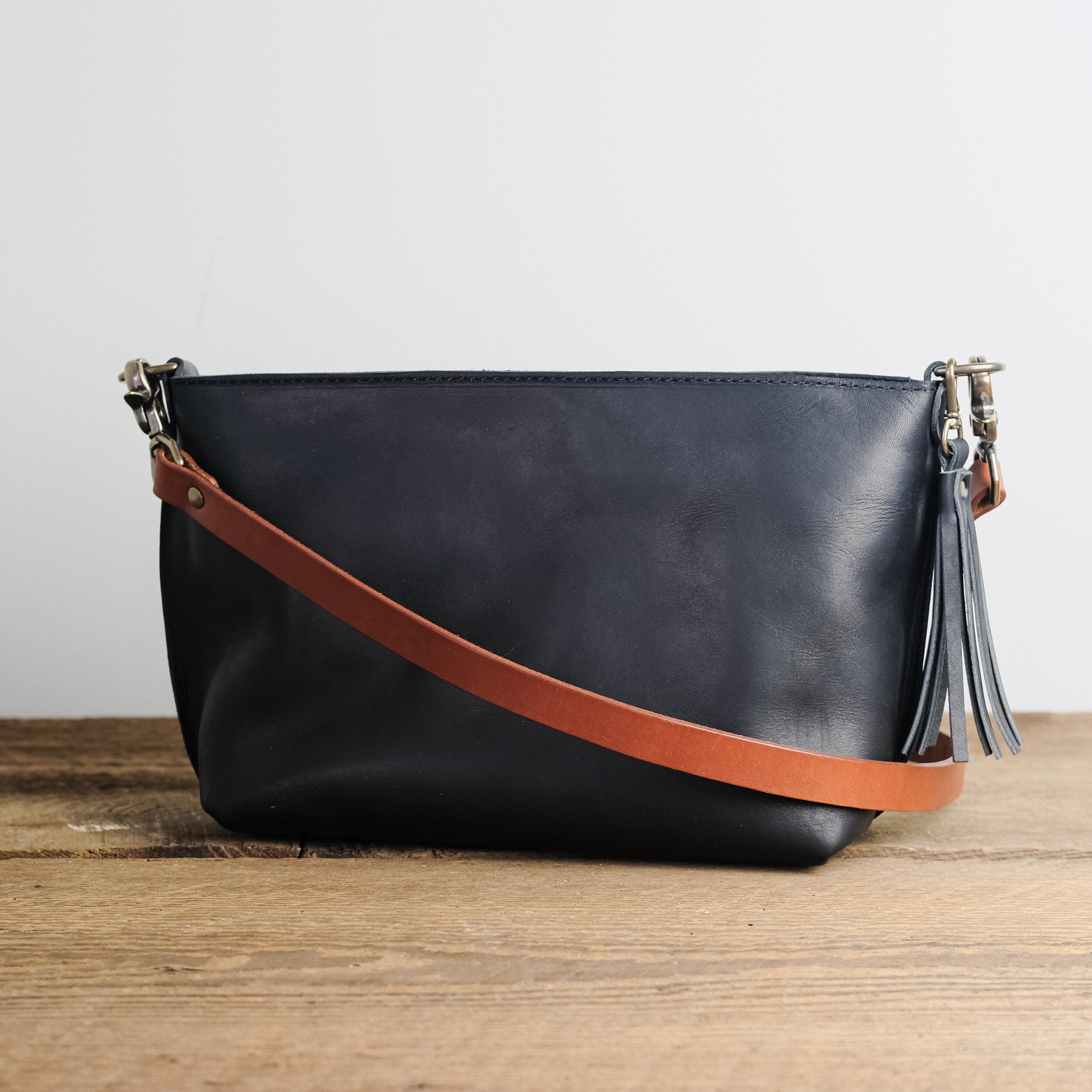 brown and black crossbody bag